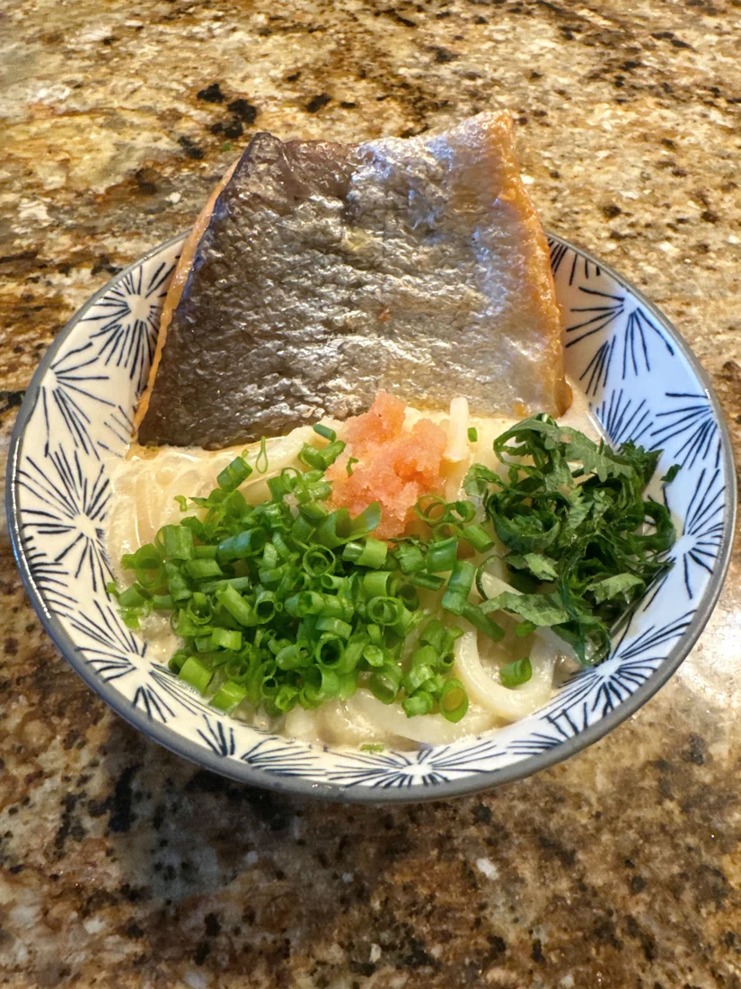 Max’s salmon mentaiko udon topped with scallions and herbs